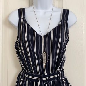 Sleeveless vertical-striped jumpsuit with belt